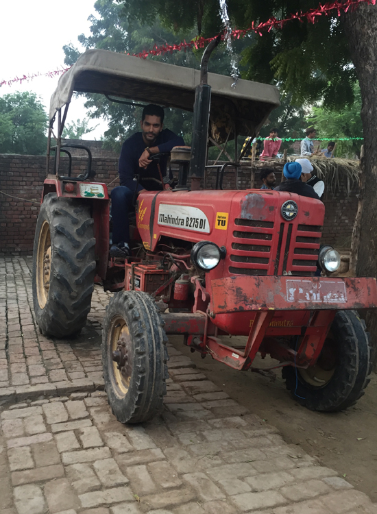 Angad Bedi driving Tractor