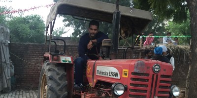 Angad Bedi driving Tractor