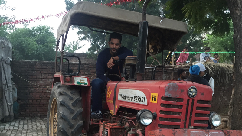 Angad Bedi driving Tractor