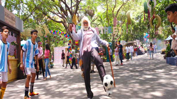 Amitabh Bachchan playing football with kids