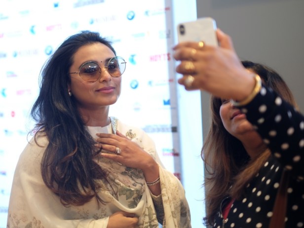 Rani Mukerji takes a pictures with a fan at IFFM 2018