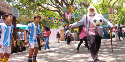 Amitabh Bachchan playing football with kids