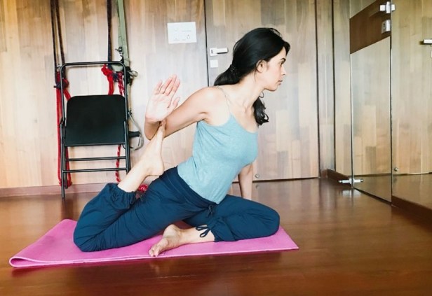 Mallika Sherawat - One legged king pigeon pose